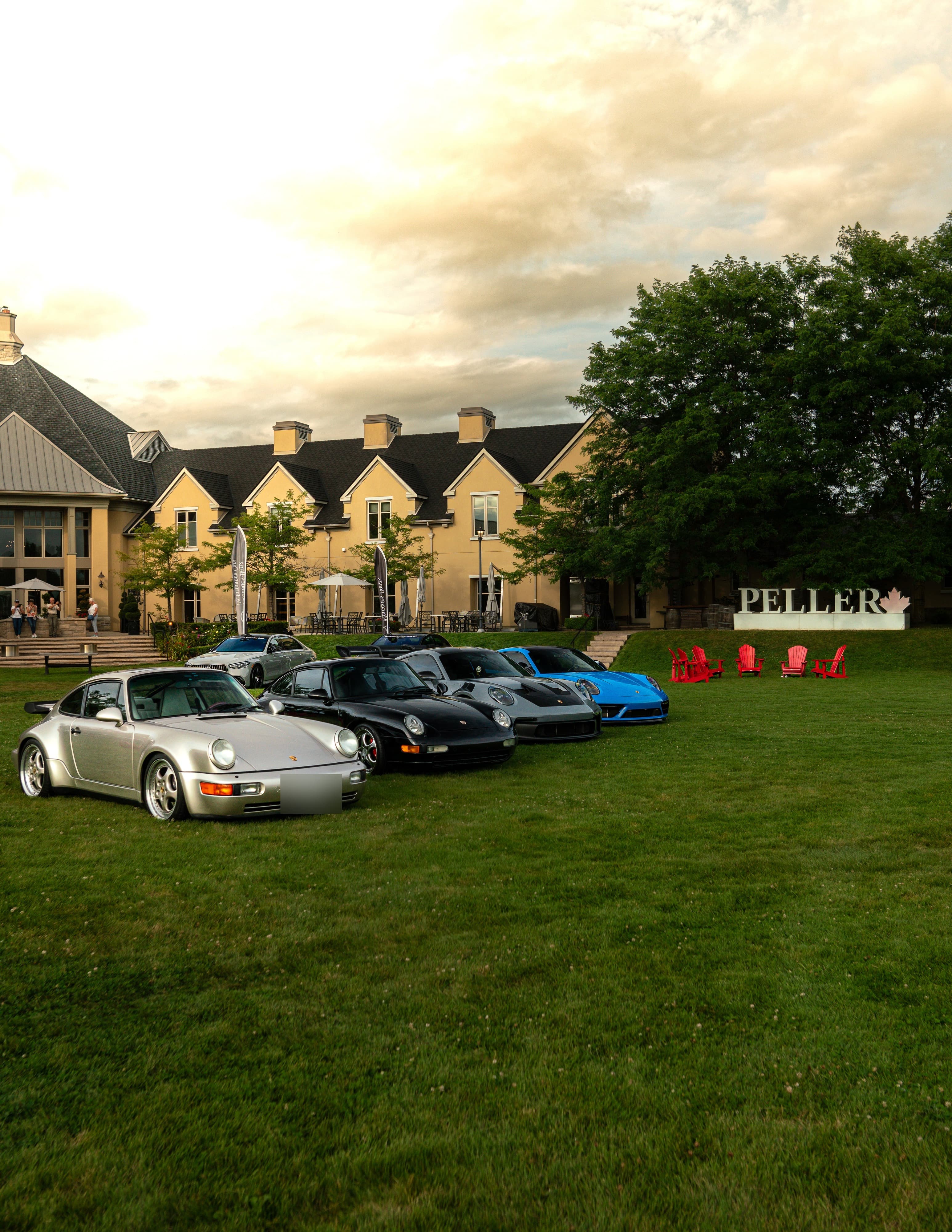 Row of Porsches parked on the lawn at Peller Estates winery